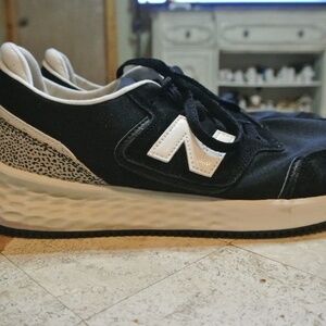 WOMENS BLACK SIZE 10, X-70 NEW BALANCE WITH LEOPARD DESIGN ON BACK